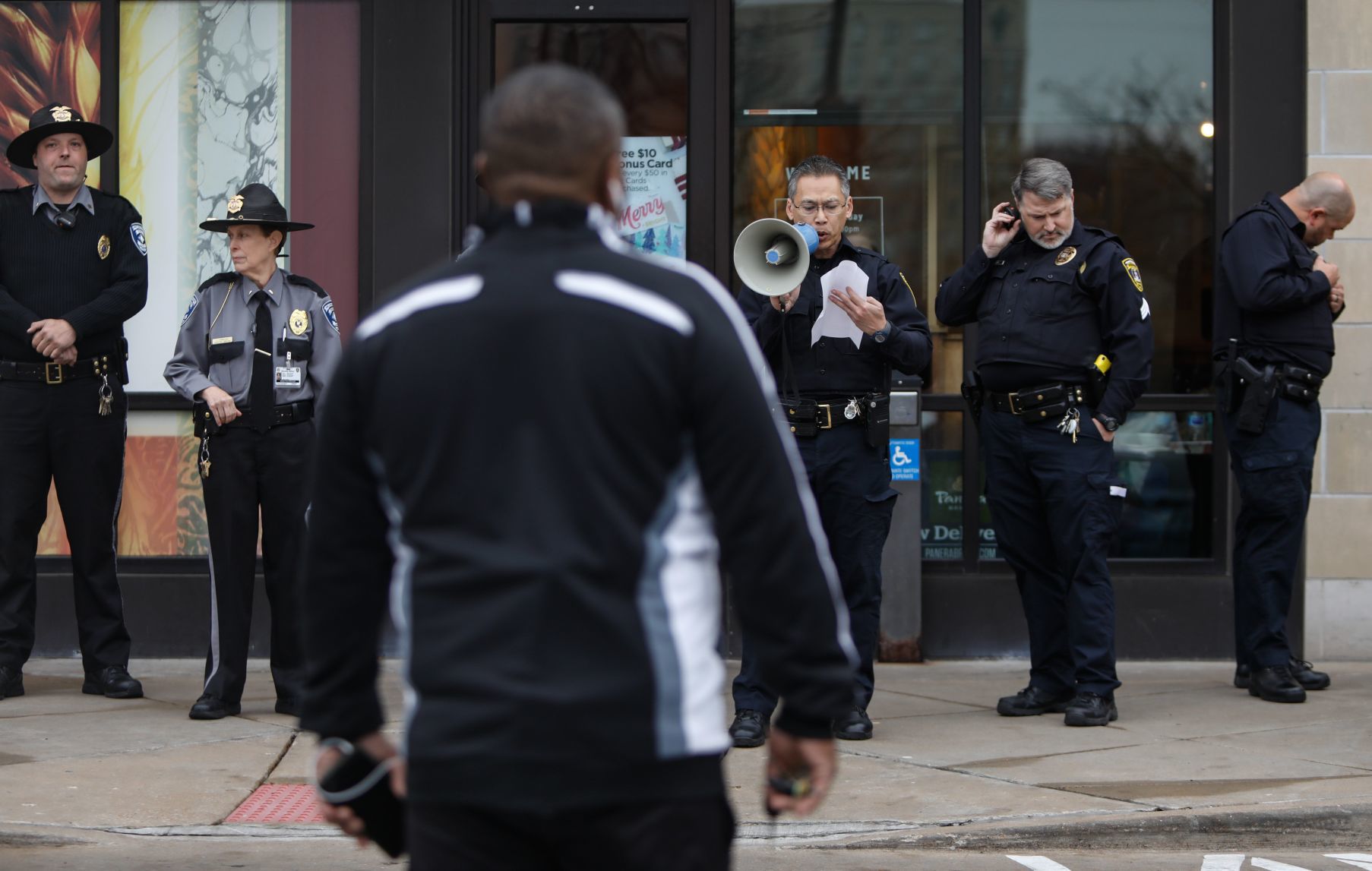 Protesters march in the St. Louis Galleria on Black Friday